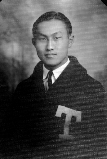 School photo of Taro Kishi at Texas A&M, wearing a letterman sweater