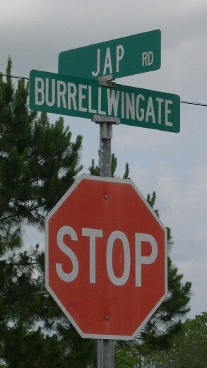 Stop sign showing the cross-street of Jap Rd. and Burrelwingate