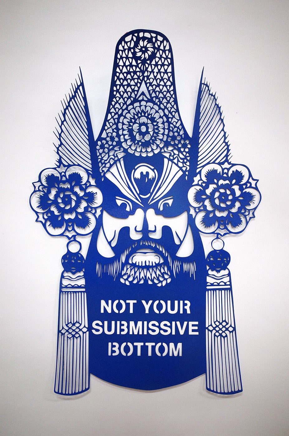 Blue paper cutting that reads "NOT YOUR SUBMISSIVE BOTTOM"
