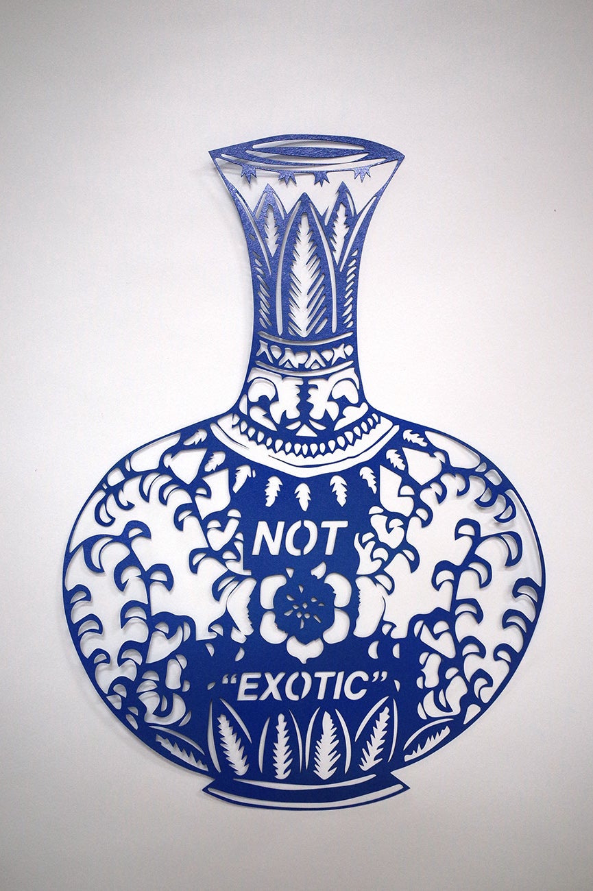 Blue paper cutting that reads "NOT EXOTIC"