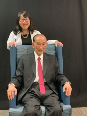 Dr. George C.Y. Chiou seated with daughter, Dr. Linda Epner standing behind