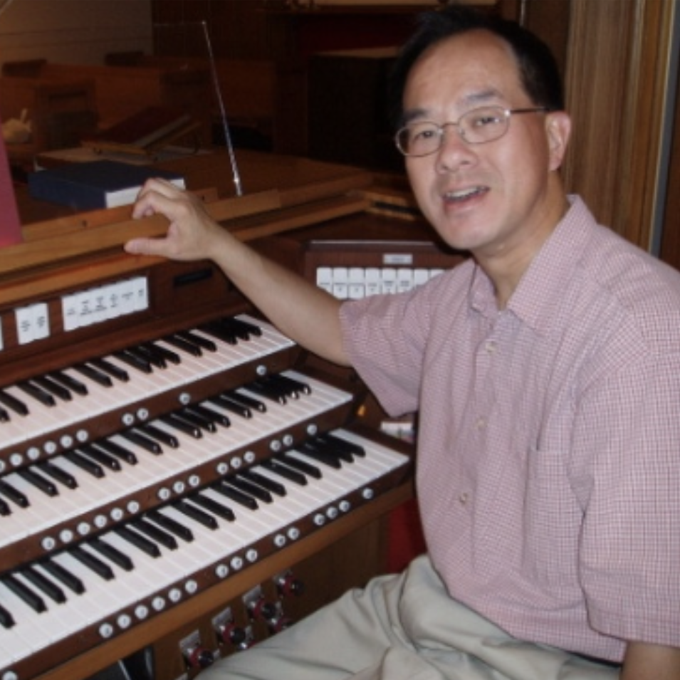 Christopher Lo sitting at an organ