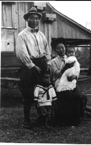 Yonekichi, Kichi, and their children, Tommy and Ruth in Kichi's handmade outfit